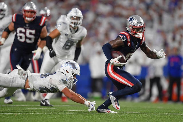 New England Patriots wide receiver Stefon Diggs, right, runs past Buffalo Bills safety Cole Bishop (Adrian Kraus/AP)