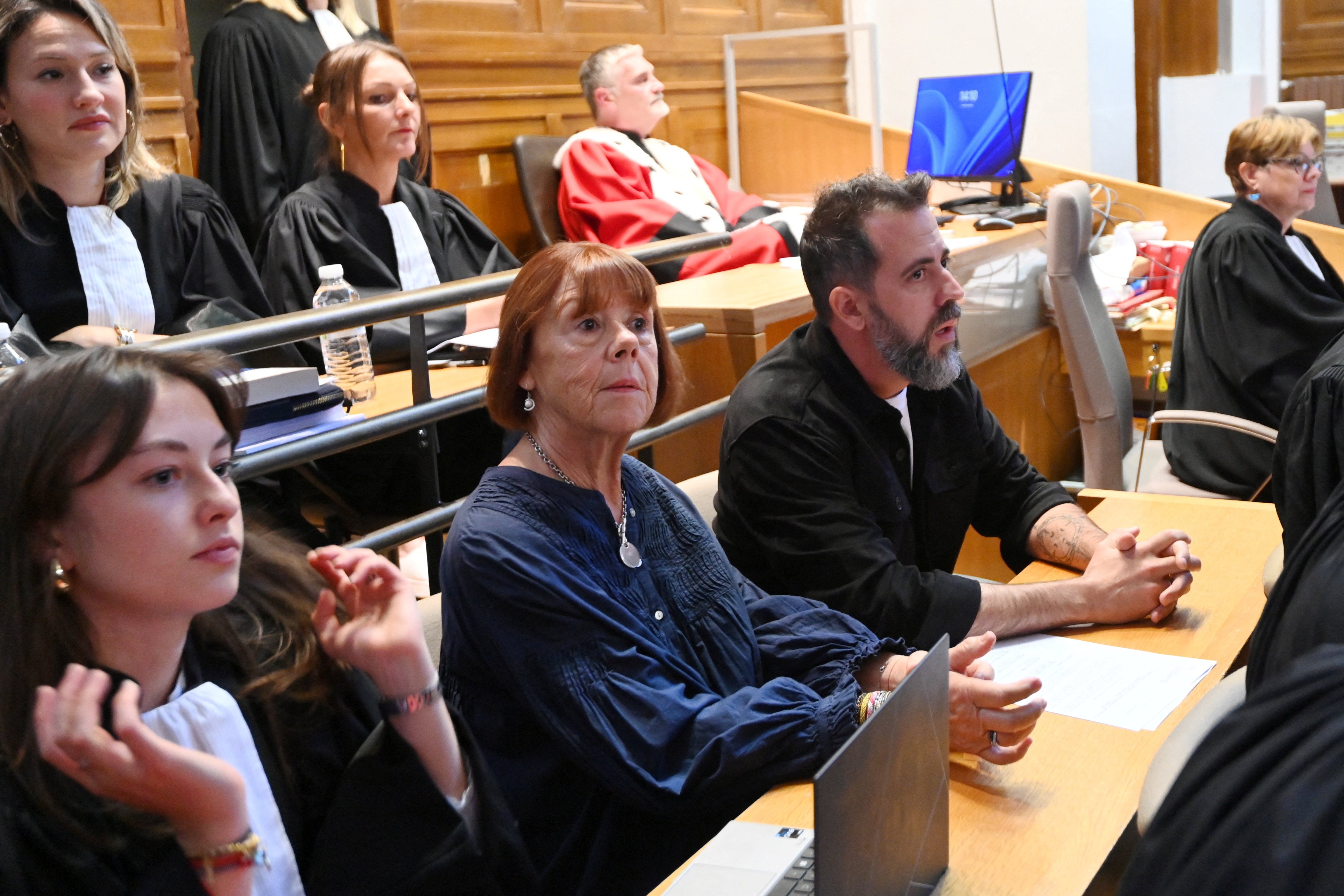 Gisele Pelicot (C) before the start of the appeal hearing on October 6, 2025
