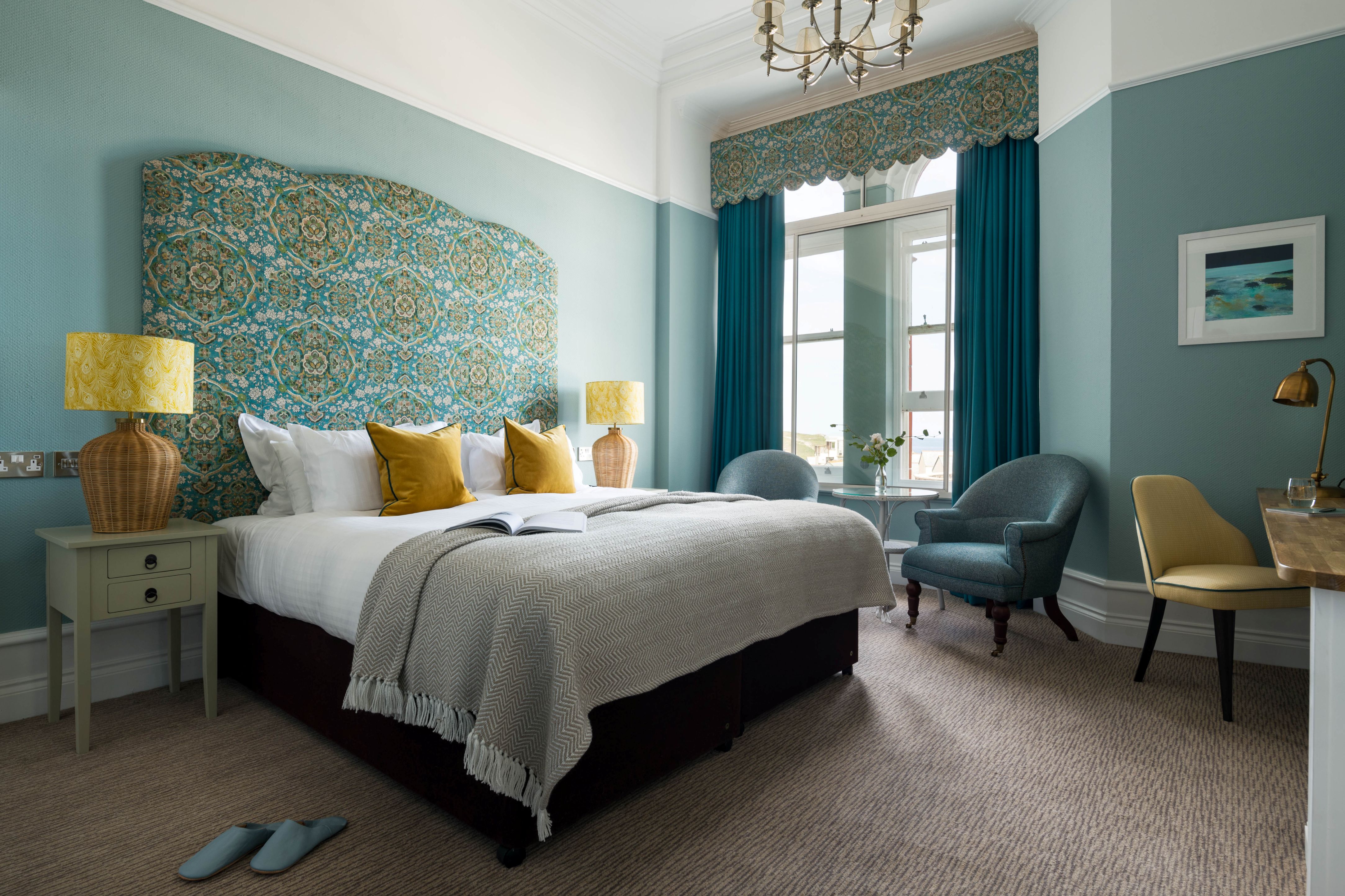 Sash windows and printed headboards can be found in rooms at The Headland
