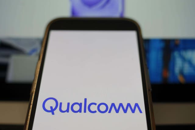 A mobile phone displaying the logo of Qualcomm