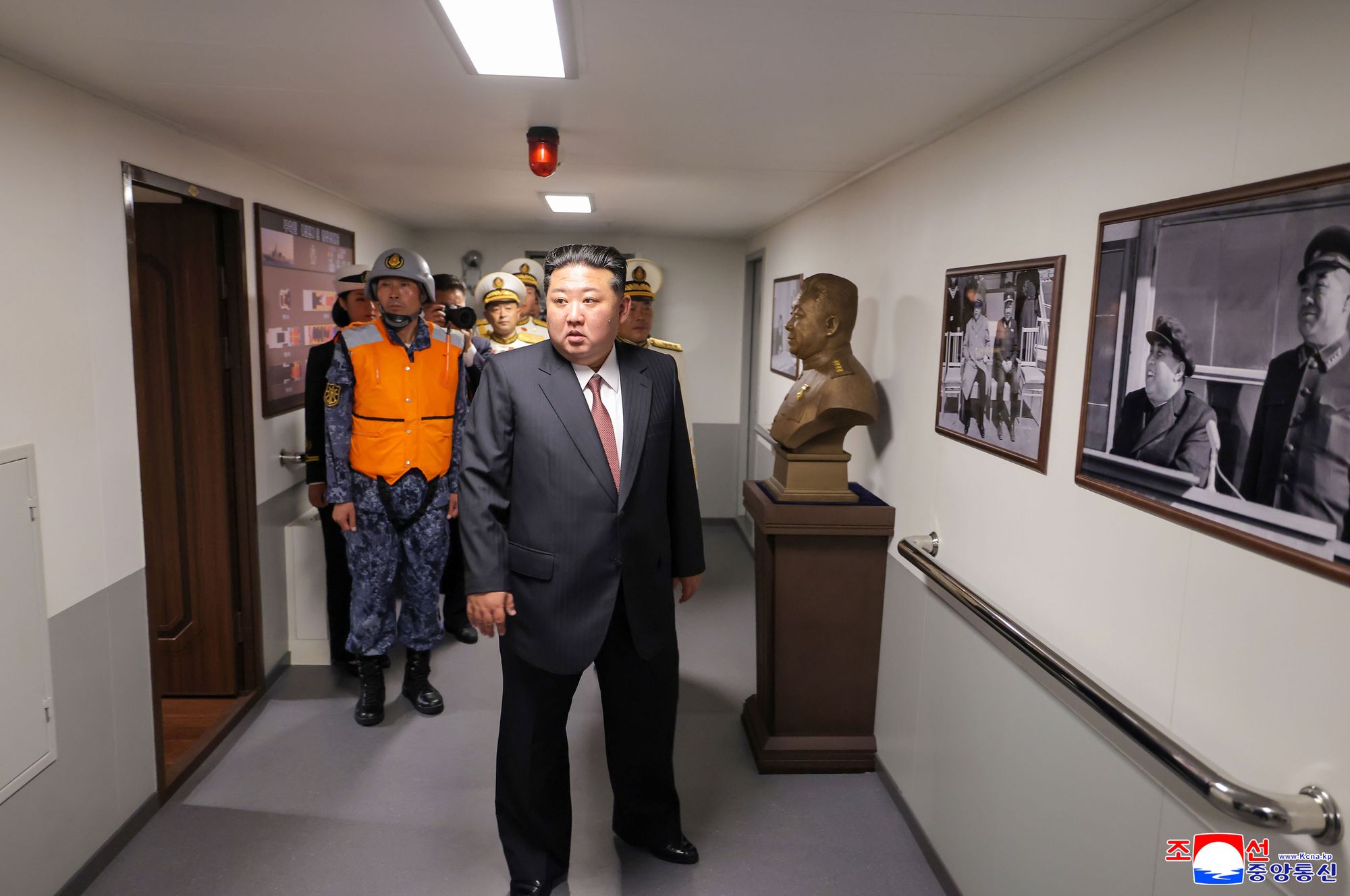 Kim visits the Choe Hyon destroyer at an undisclosed location on 5 October