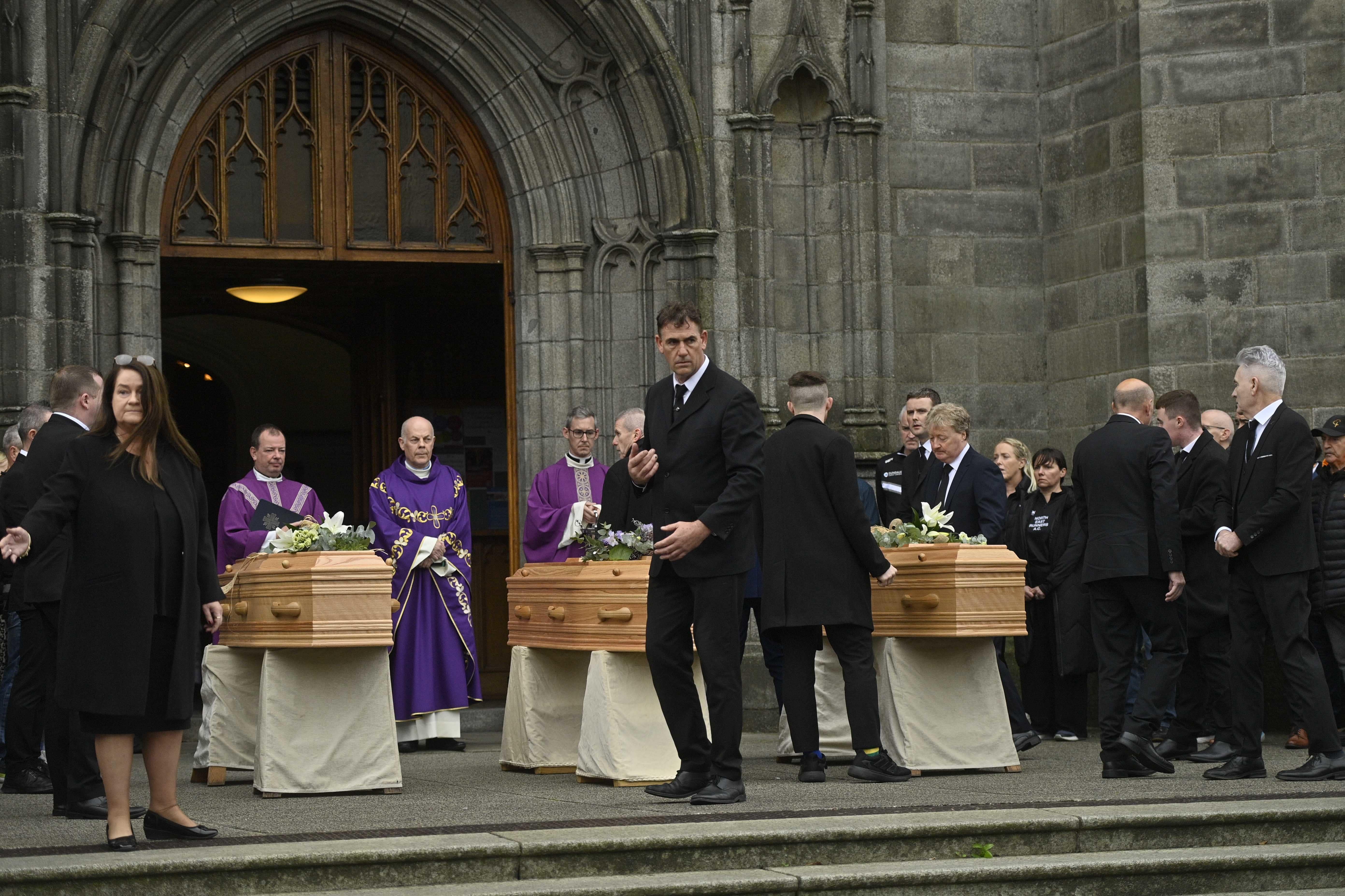 The coffins of Mark O’Connor, Louise Doherty O’Connor and their son Evan at St Patrick’s Church in Dundalk for their funeral (Mark Marlow/PA)