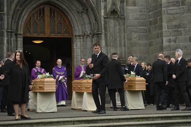 The coffins of Mark O’Connor, Louise Doherty O’Connor and their son Evan at St Patrick’s Church in Dundalk for their funeral (Mark Marlow/PA)