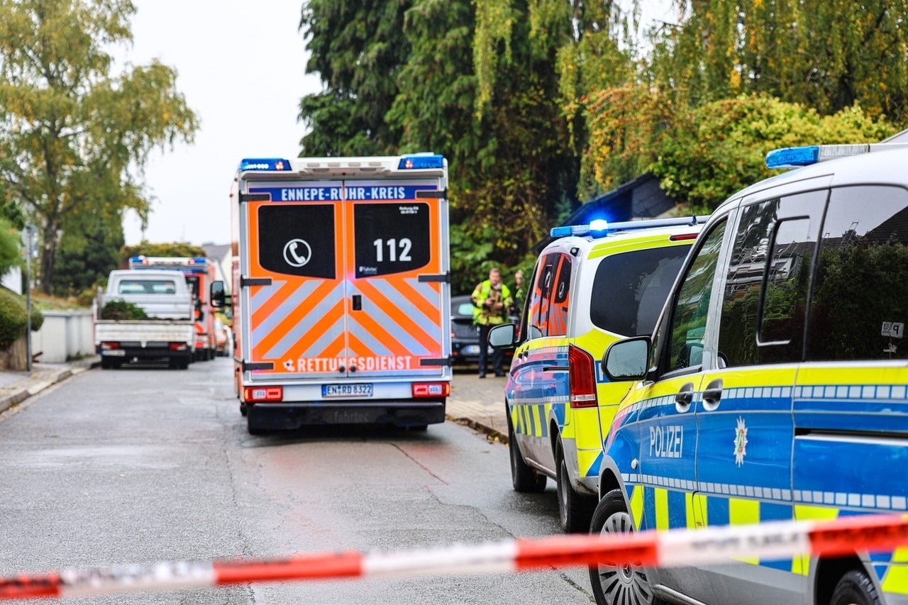 Ambulances are seen on a residential street