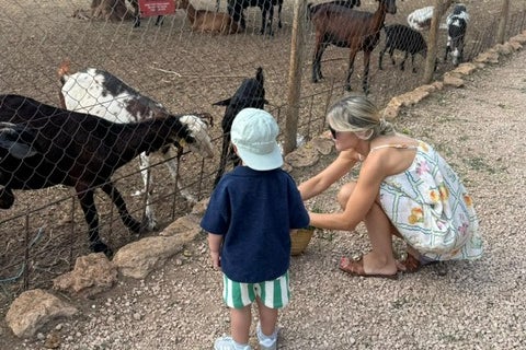 Feeding the goats at Can Muson Farm in Ibiza (Leeanna Lock)