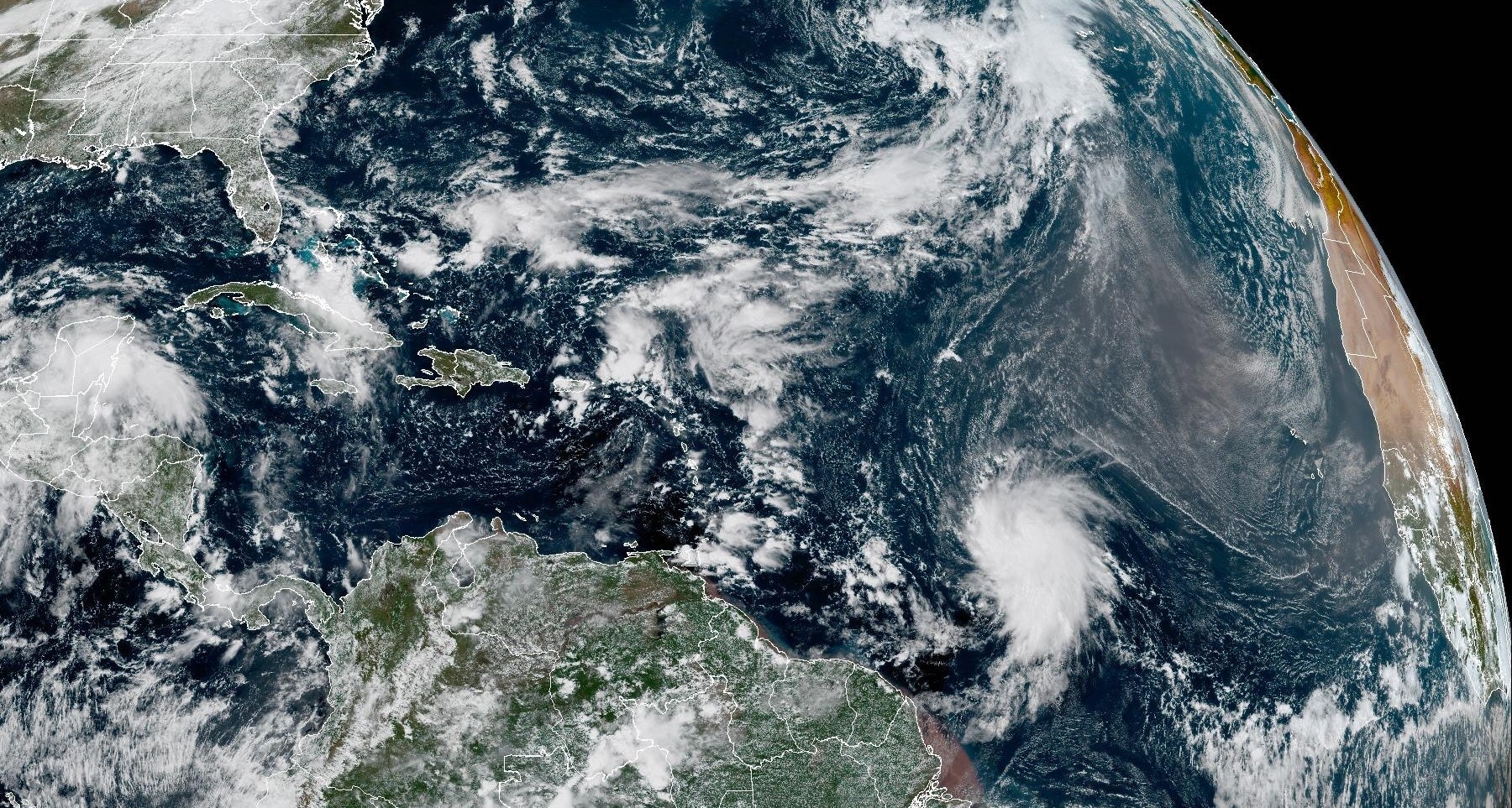 <p>Tropical Storm Jerry is seen churning over the Atlantic Ocean on Tuesday in this satellite image</p>