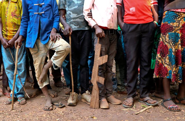 <p>Former child soldiers stand in line waiting to be registered with UNICEF to receive a release package, in Yambio, South Sudan</p>