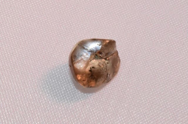 <p> The white round diamond was about the size of a pea</p>