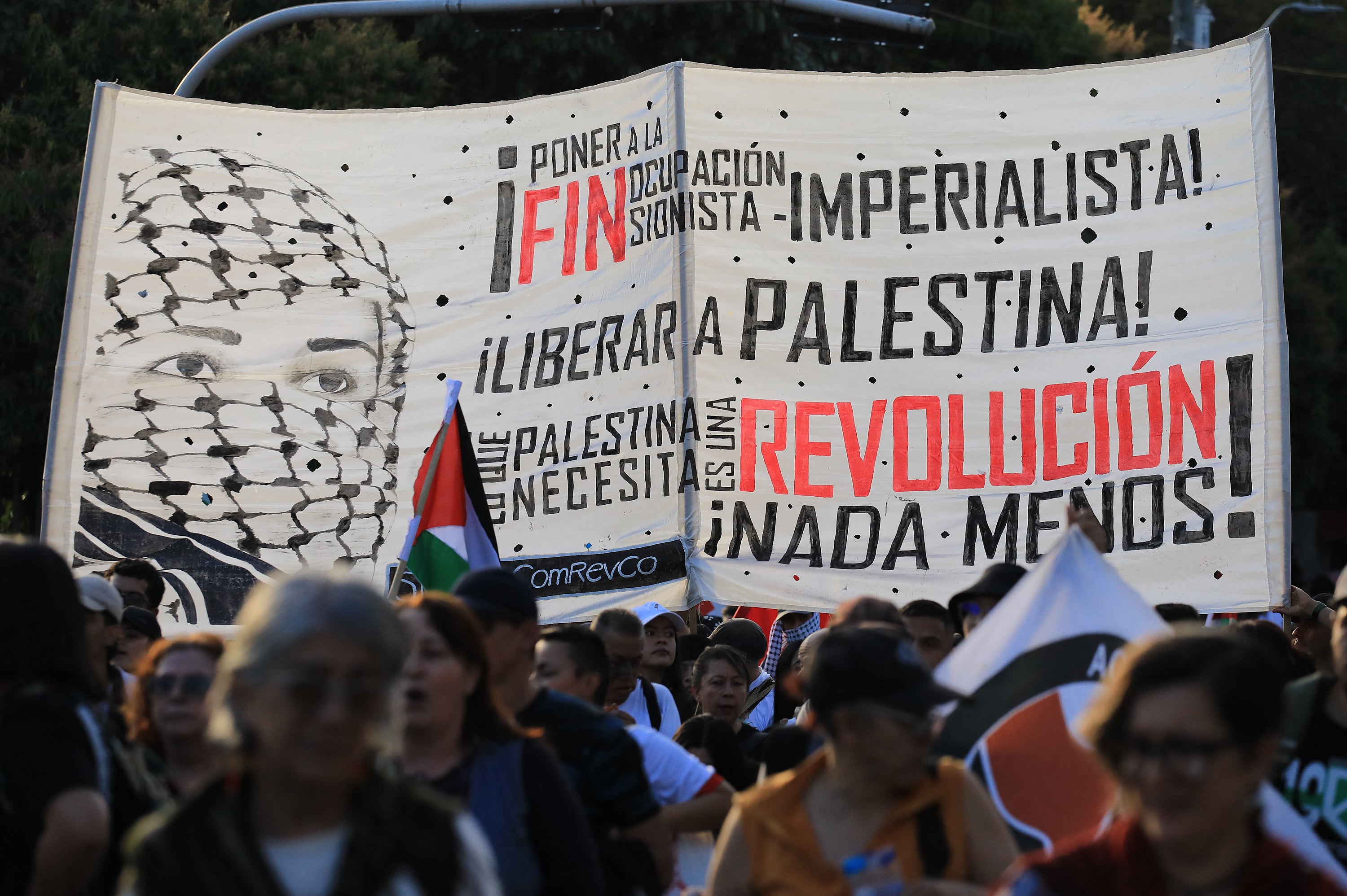 Demonstrators show a sign during a march to demand the end to attacks on the Gaza Strip and Palestinian territories in Medellin, Colombia