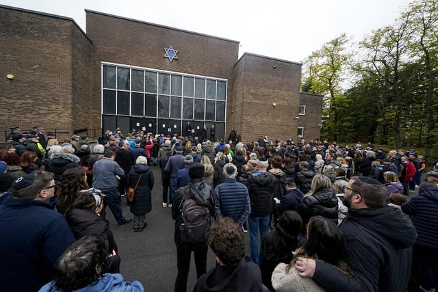 Members of the community gather at Heaton Park Hebrew Synagogue in Crumpsall, Manchester (Peter Byrne/PA)