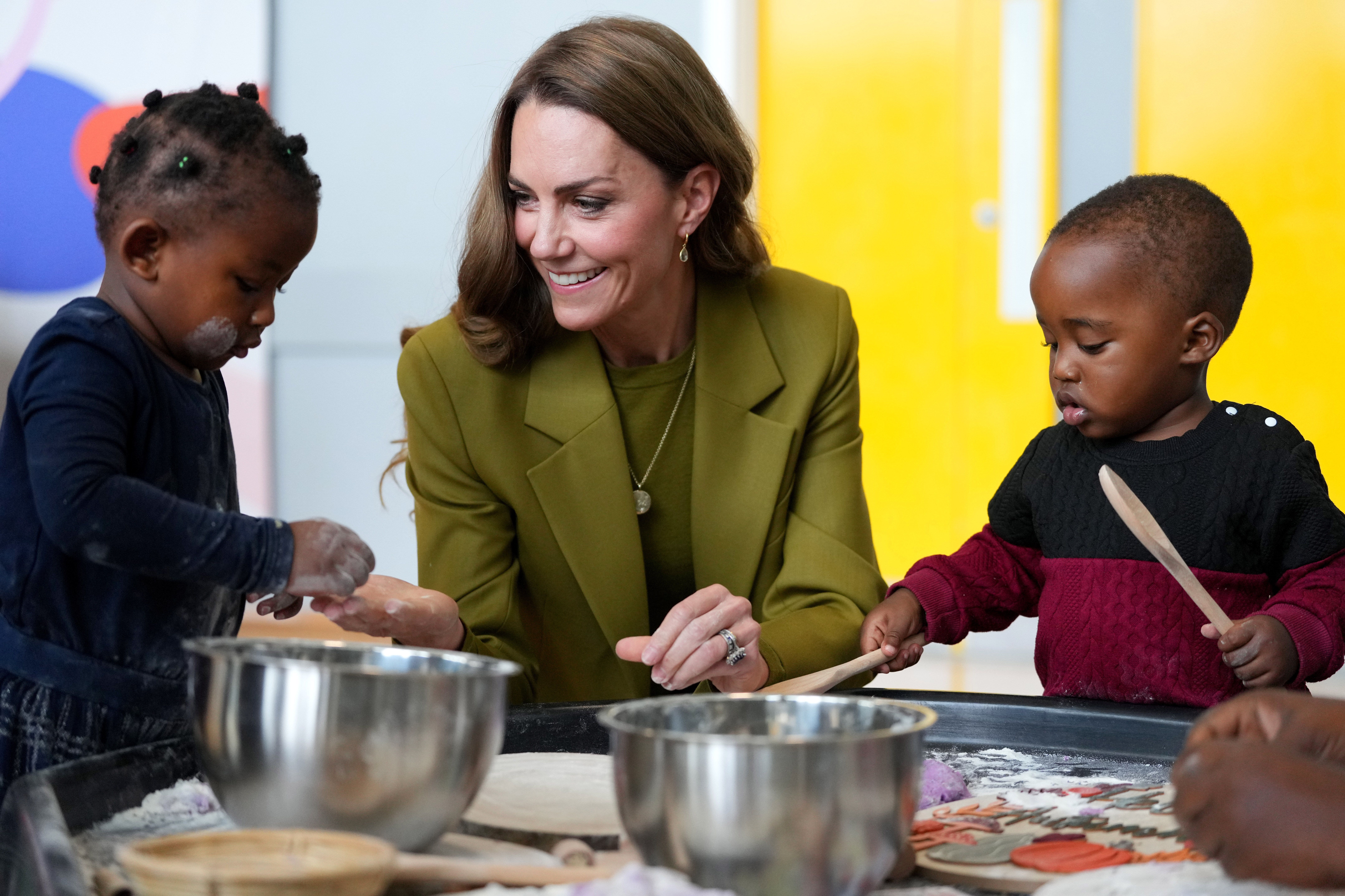 The Princess of Wales plays with children during a visit to Home-Start in Oxford (Kirsty Wigglesworth/PA)