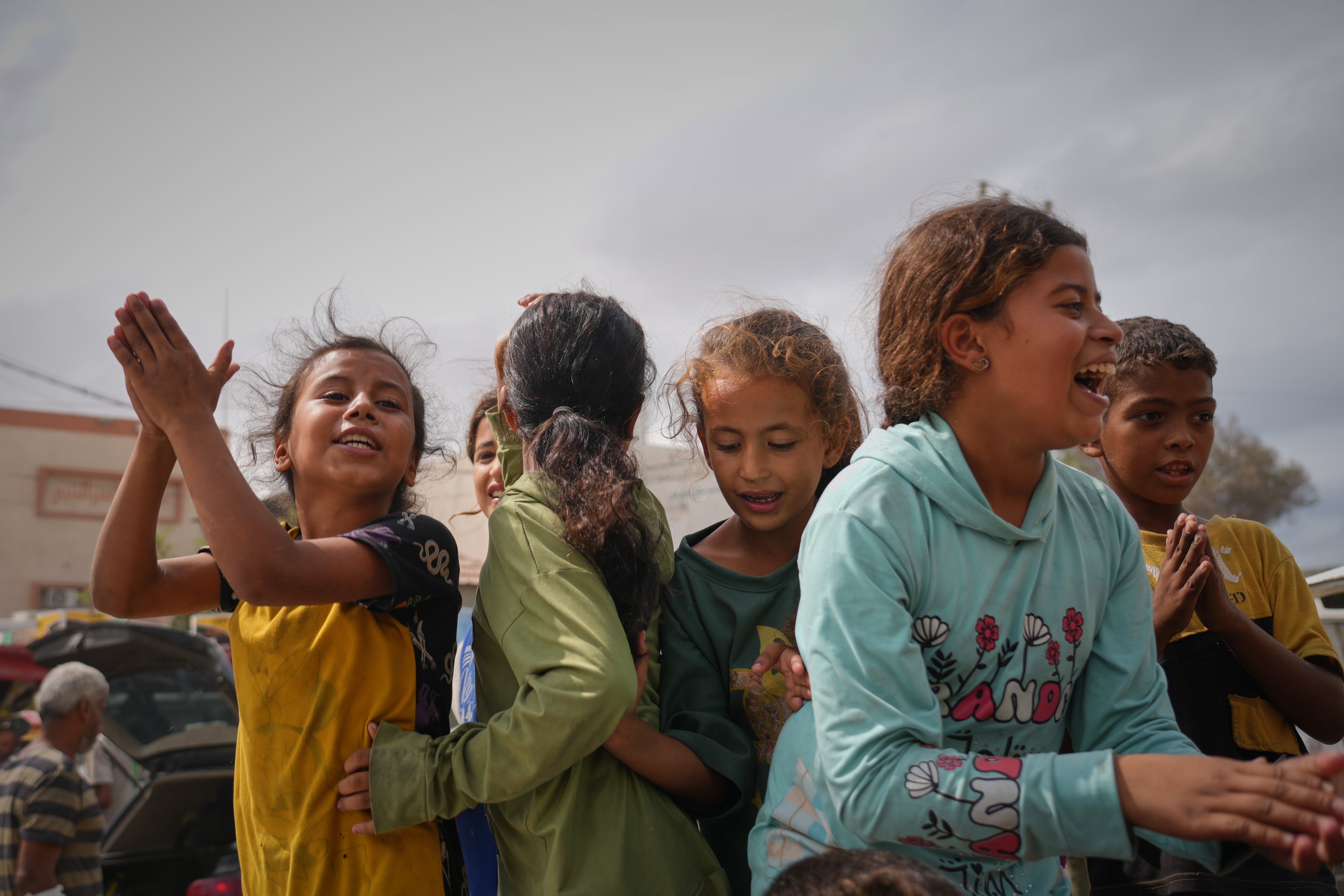 Palestinians celebrate following the announcement, in Khan Younis, southern Gaza Strip