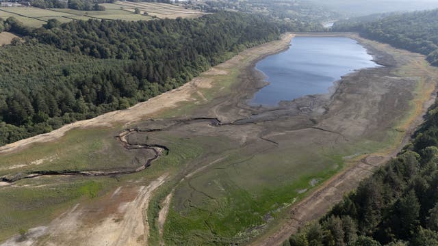<p>A general view of low water levels at Broomhead Reservoir, South Yorkshire with dramatically low water levels this summer (Richard McCarthy/PA)</p>