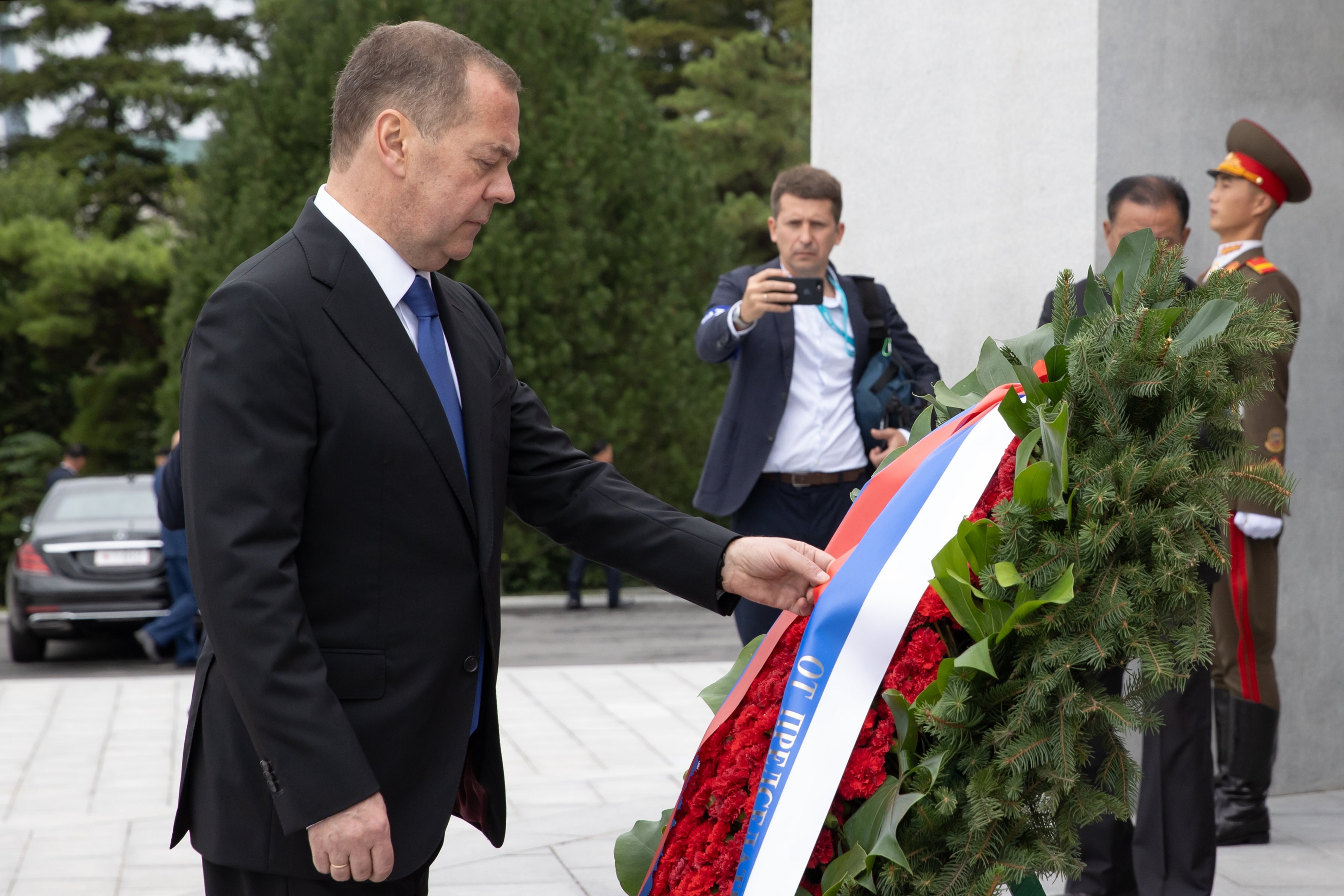 Russian Security Council Deputy Chairman and the head of the United Russia party Dmitry Medvedev attends a wreath laying ceremony at the statues of former North Korean leaders Kim Il Sung and Kim Jong Il