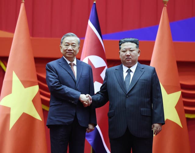 <p>North Korean leader Kim Jong Un, right, and Vietnamese General Secretary of Communist Party To Lam shake hands in Pyongyang, North Korea</p>
