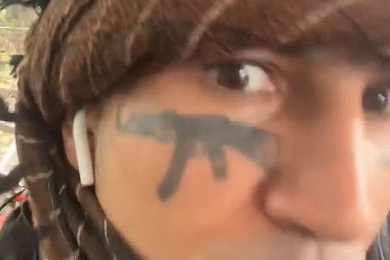 Khan has an AK-47 tattoo across his face (CPS/PA)