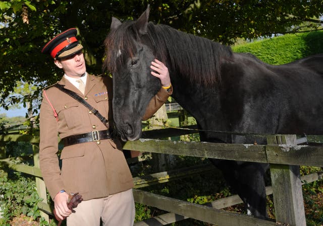 <p>Life Guard Squadron Leader Major Tom Stewart says goodbye to Household Cavalry horse Quaker as he begins his retirement at The Horse Trust sanctuary in Princes Risborough, Buckinghamshire</p>