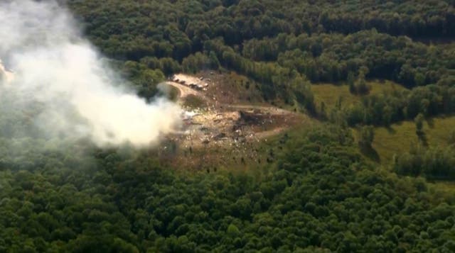 <p>Smoke rises from the debris of a military explosives manufacturing plant in Tennessee. The plant exploded Friday morning</p>