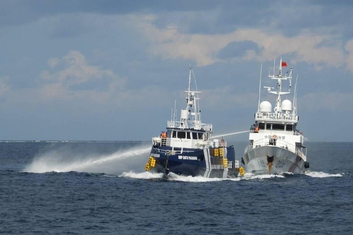 Chinese coast guard rams and damages a Philippine vessel off an island in the South China Sea