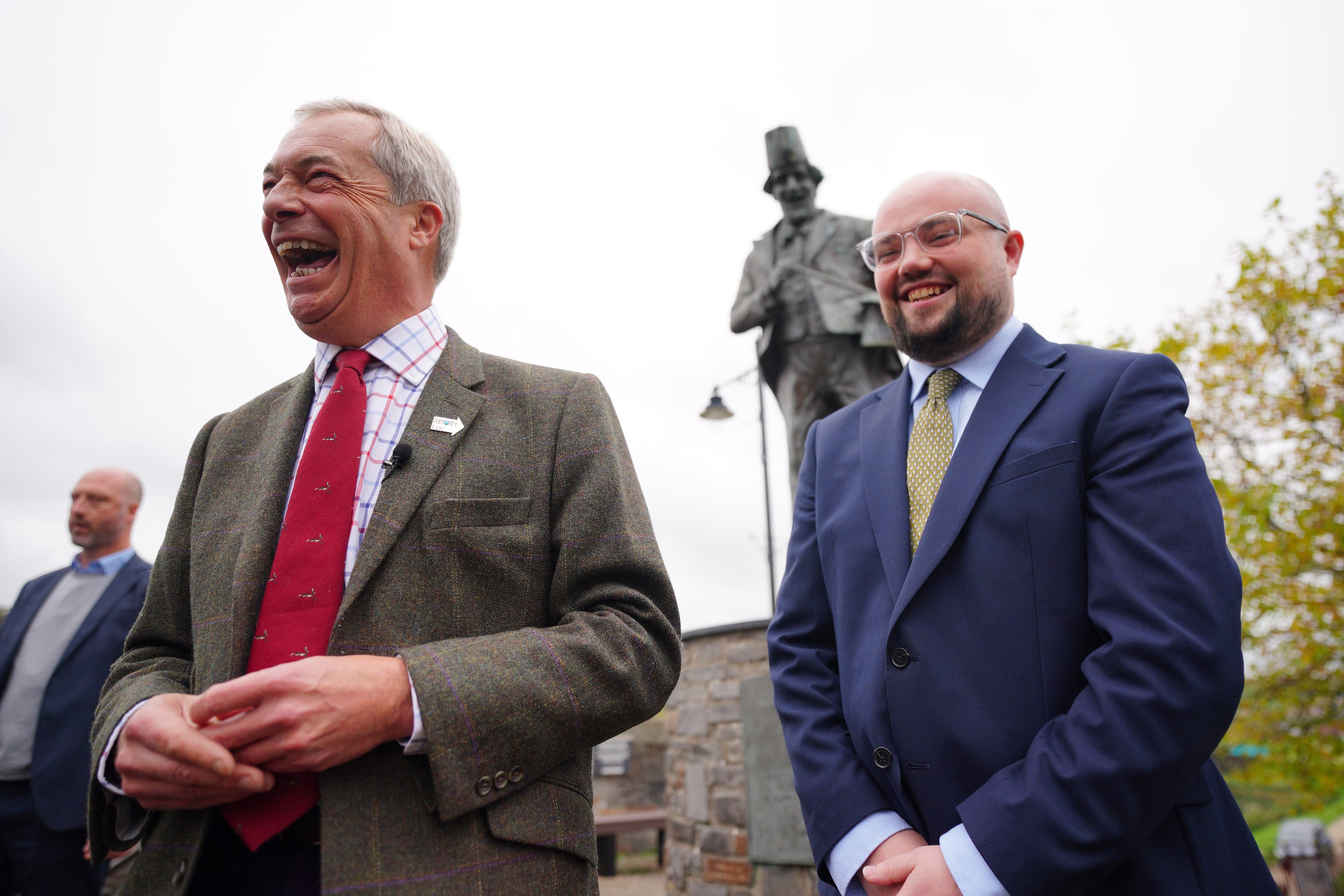 Reform UK leader Nigel Farage with candidate Llyr Powell during a visit to Caerphilly