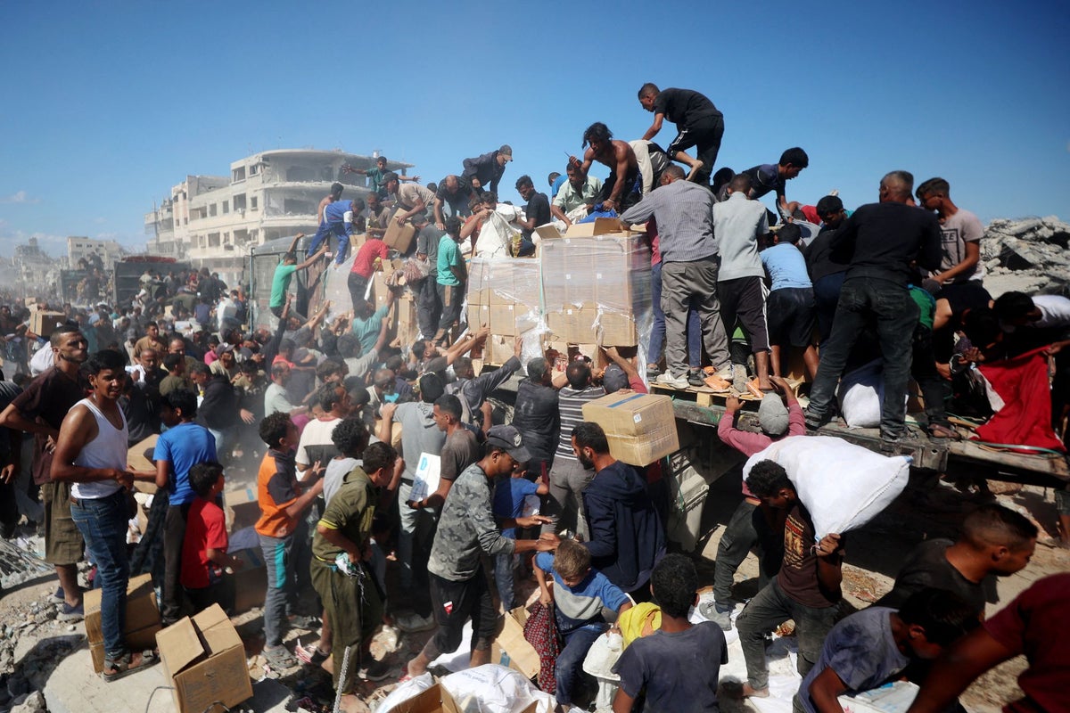 Palestinians surround Gaza aid truck in desperate bid to gather supplies