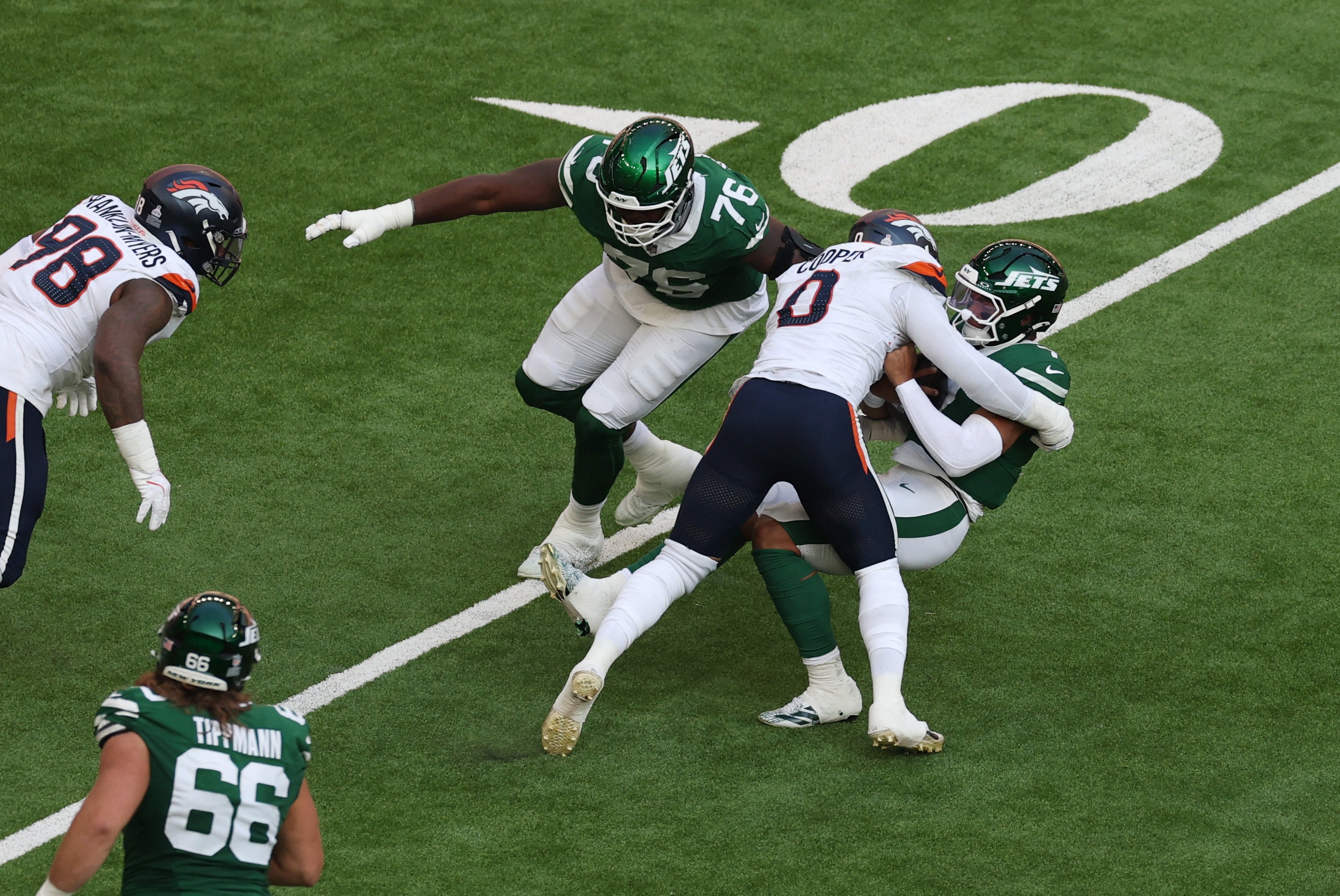 Justin Fields was sacked nine times as the Broncos overcame the Jets