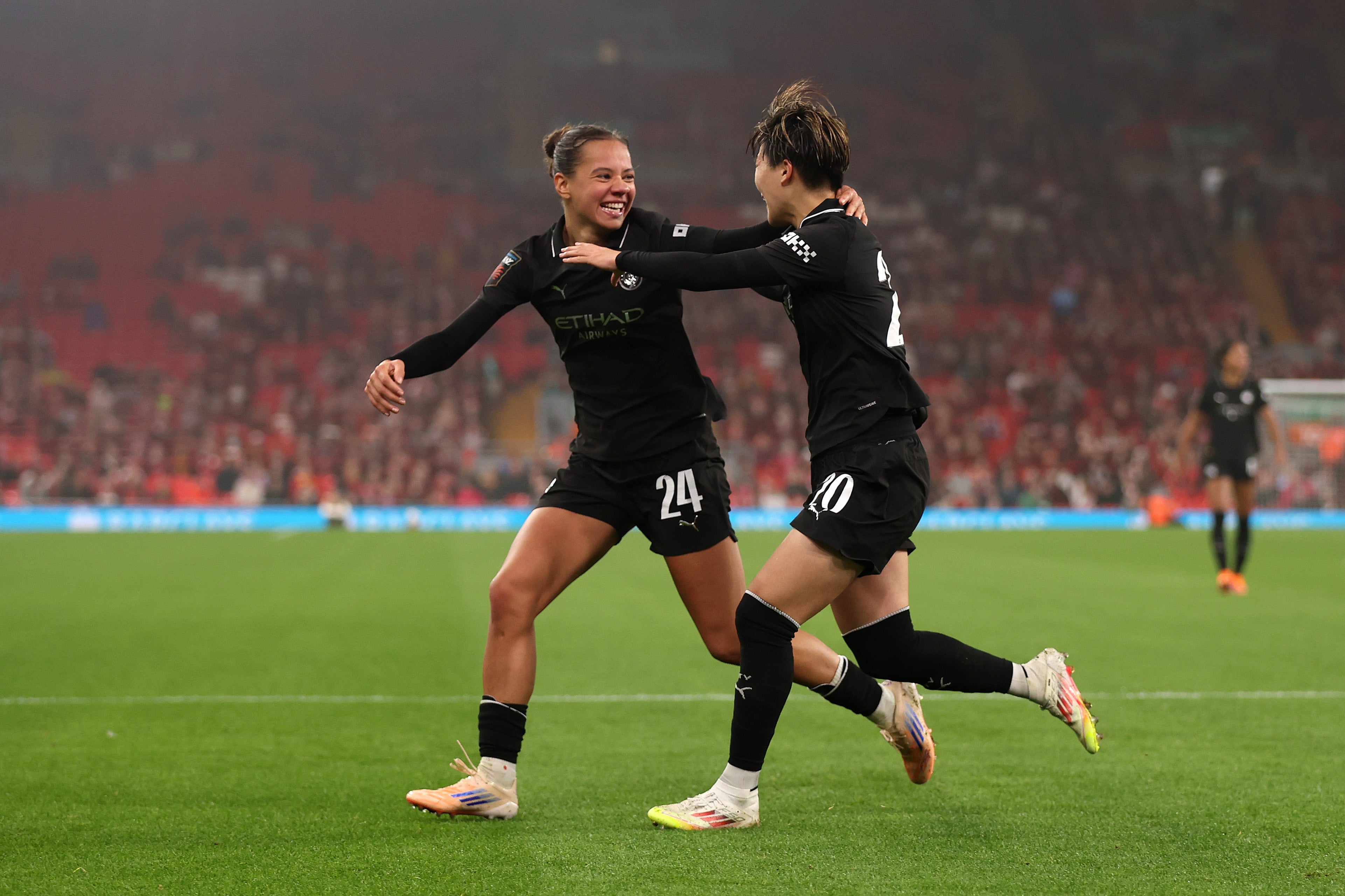 Aoba Fujino of Manchester City celebrates with Iman Beney