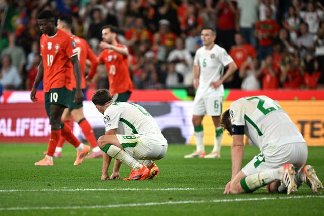 <p>Republic of Ireland's Nathan Collins (right) and Jayson Molumby look dejected following defeat in the FIFA World Cup European Qualifying match at th</p>