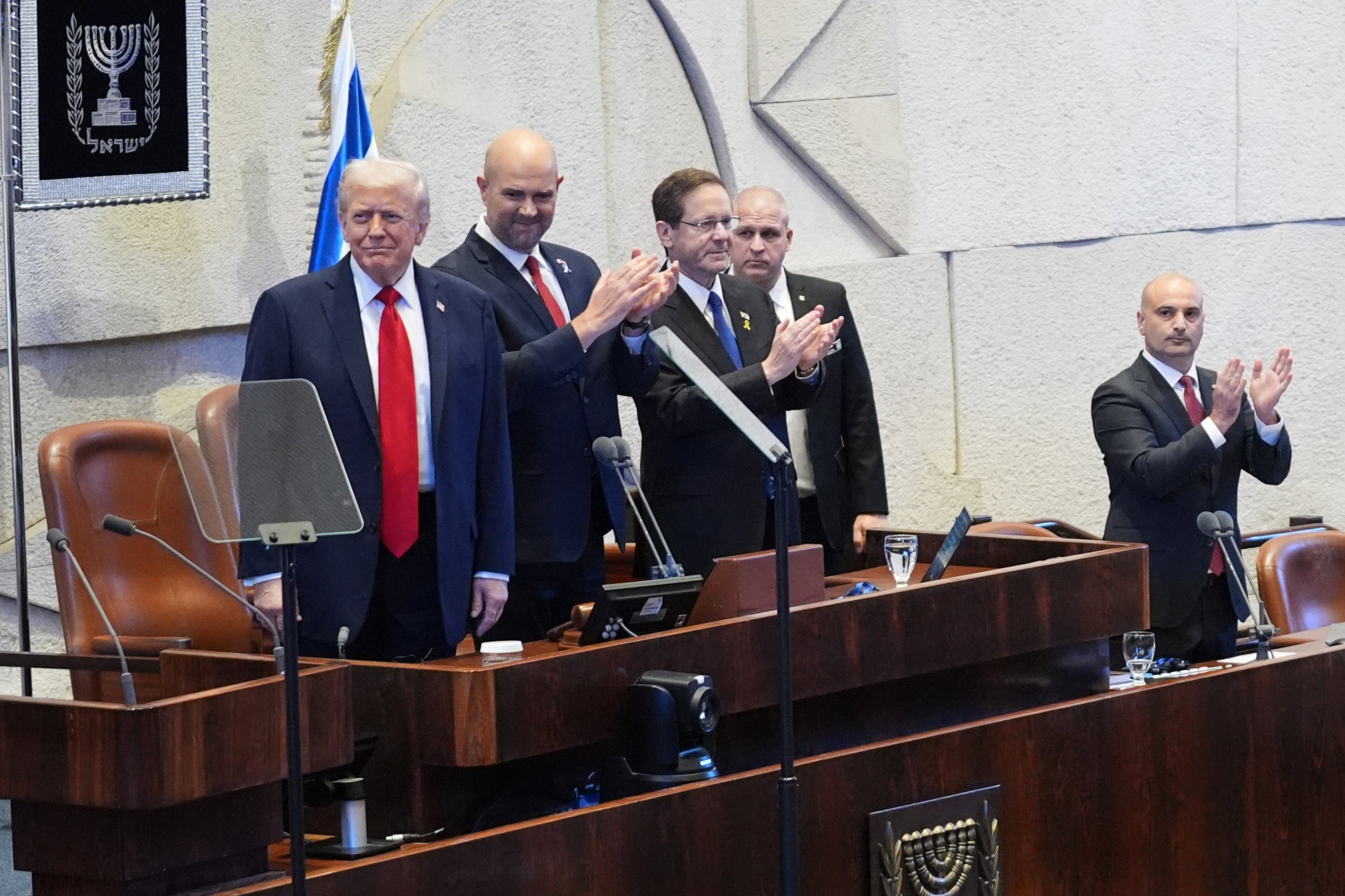 Trump (left) appealed to Herzog (third from the left) to pardon Netanyahu during a visit to Israel in October