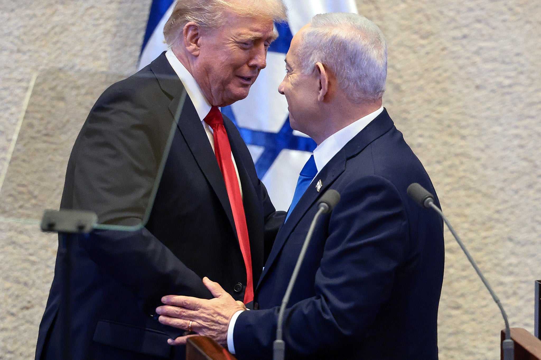 Trump shakes hands and speaks with Netanyahu at the Knesset
