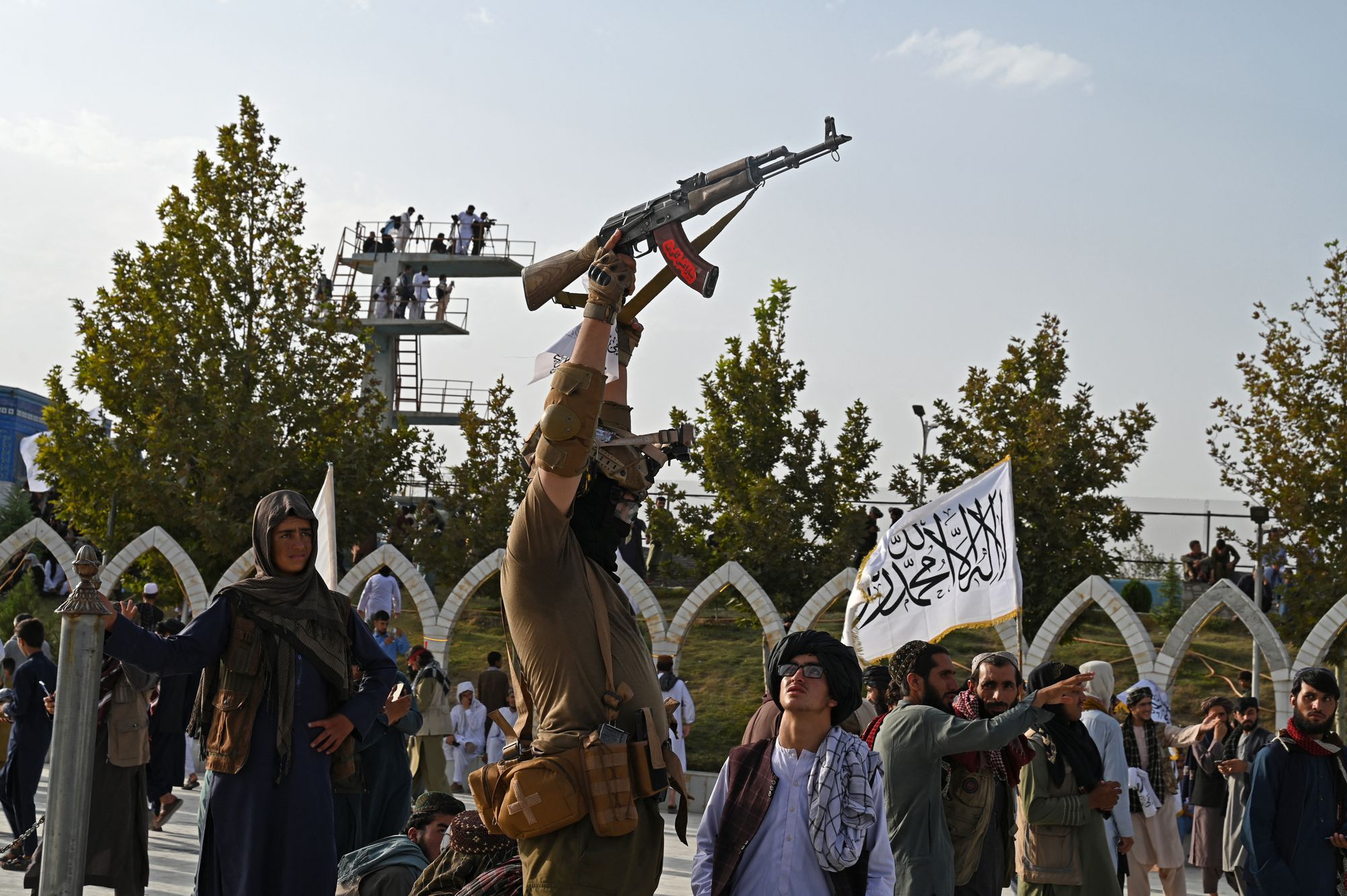 A Taliban security personnel celebrates the fourth anniversary of their takeover of Afghanistan, at the Wazir Akbar Khan hilltop in Kabul on August 15, 2025.