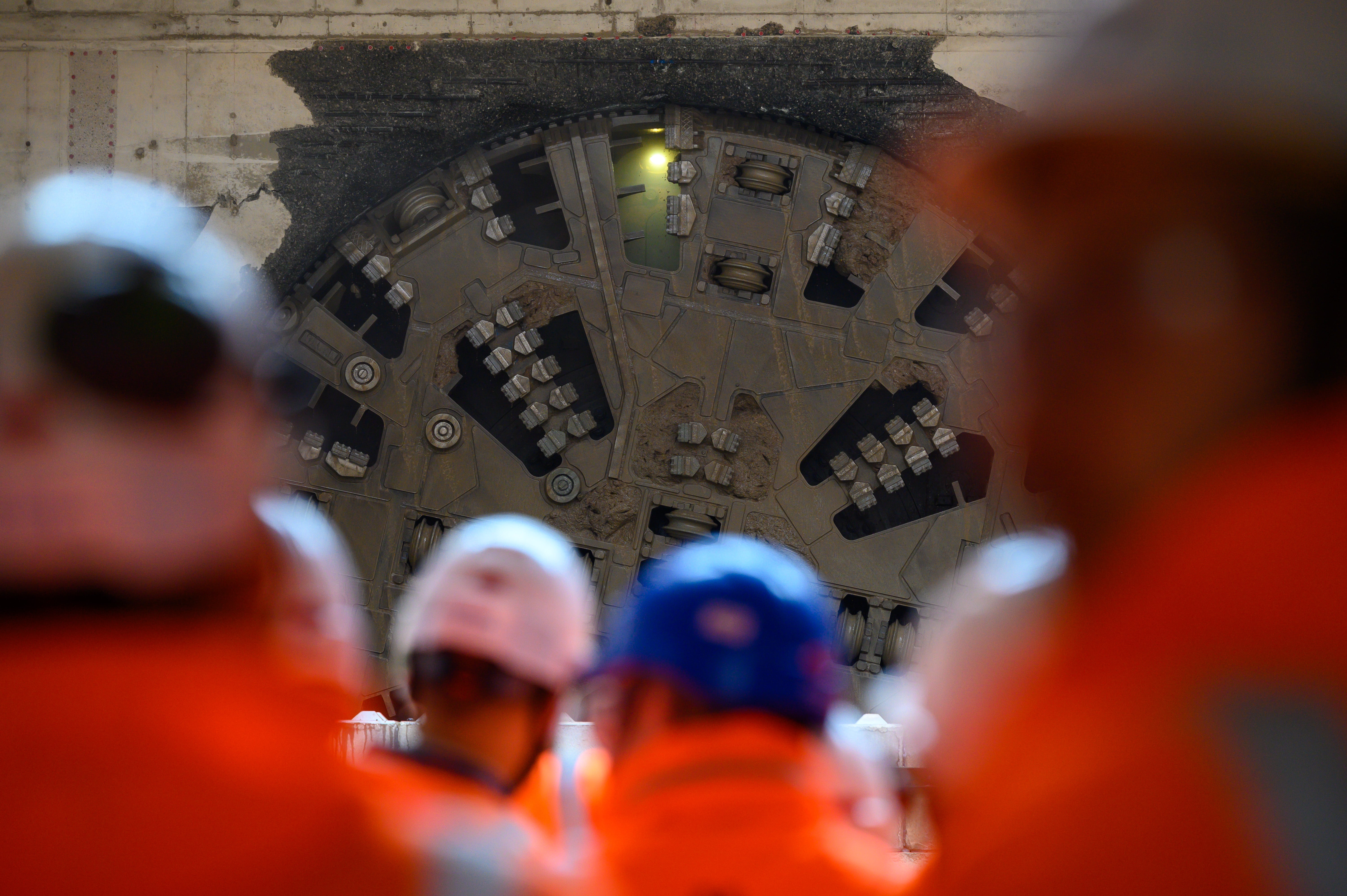 HS2 workers watch as a tunnel boring machine breaks through (HS2 Ltd/PA)