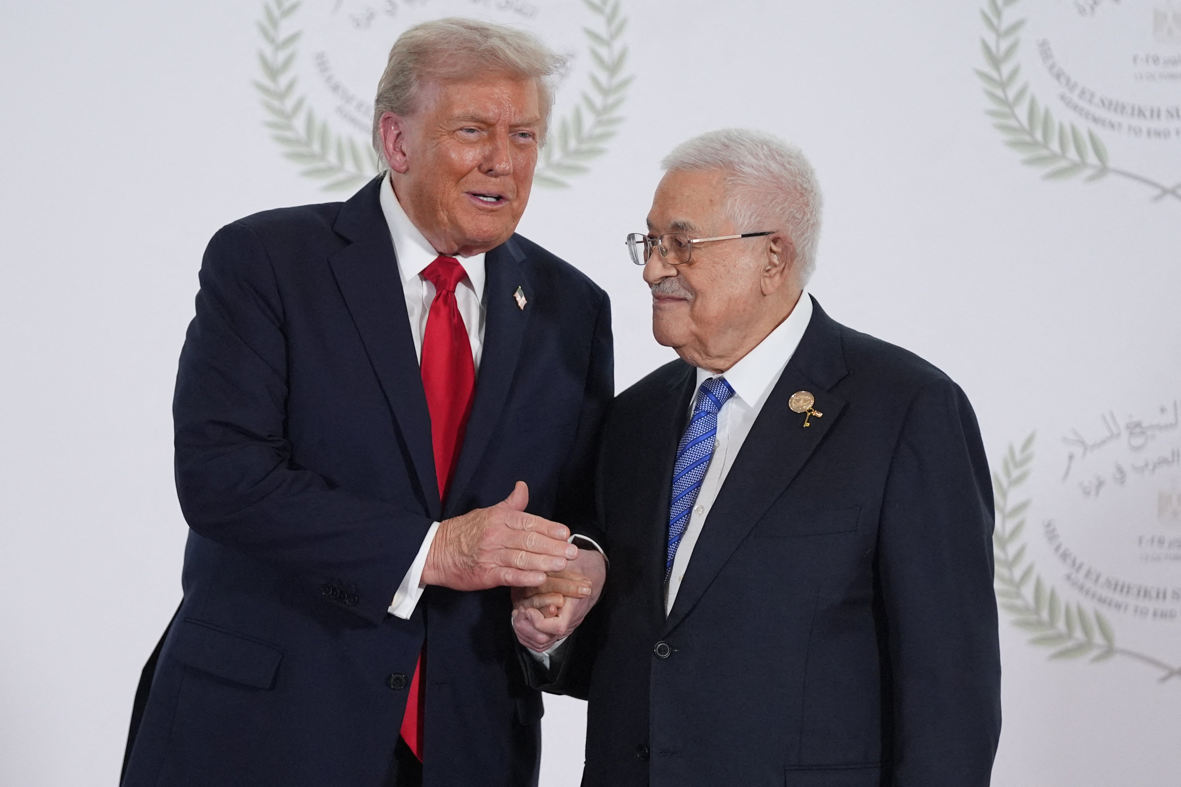 Trump greets Mahmoud Abbas during a summit on Gaza in Sharm el-Sheikh on Monday