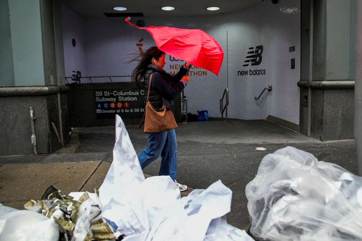 https://static.independent.co.uk/2025/10/13/17/00/A-person-struggles-with-her-umbrella-as-she-walks-through-wind-and-rain-during-a-noreaster-storm-in.jpeg?width=1200&height=800&crop=1200:800