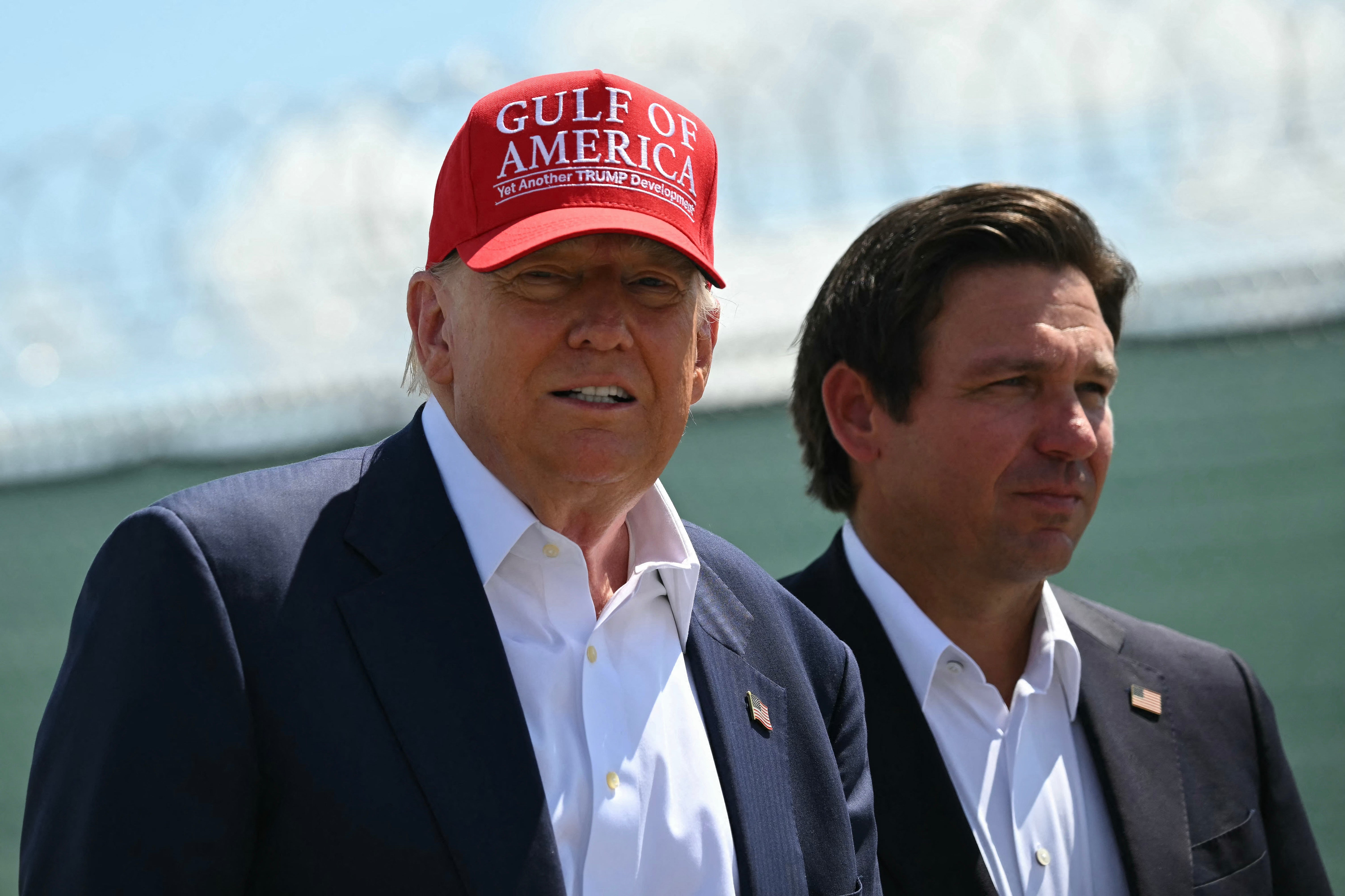 A law signed by Florida Governor Ron DeSantis was designed to impose criminal charges against anti-Trump protests. Four college football fans who rushed a field are the first to face them