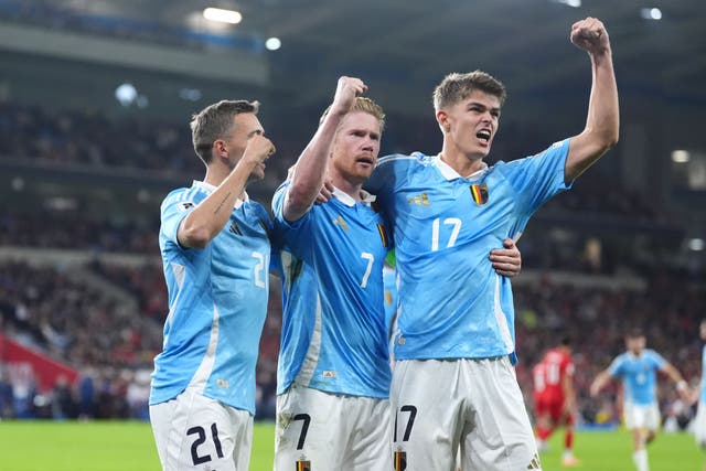 <p>Kevin De Bruyne (centre) celebrates scoring Belgium’s third goal against Wales </p>