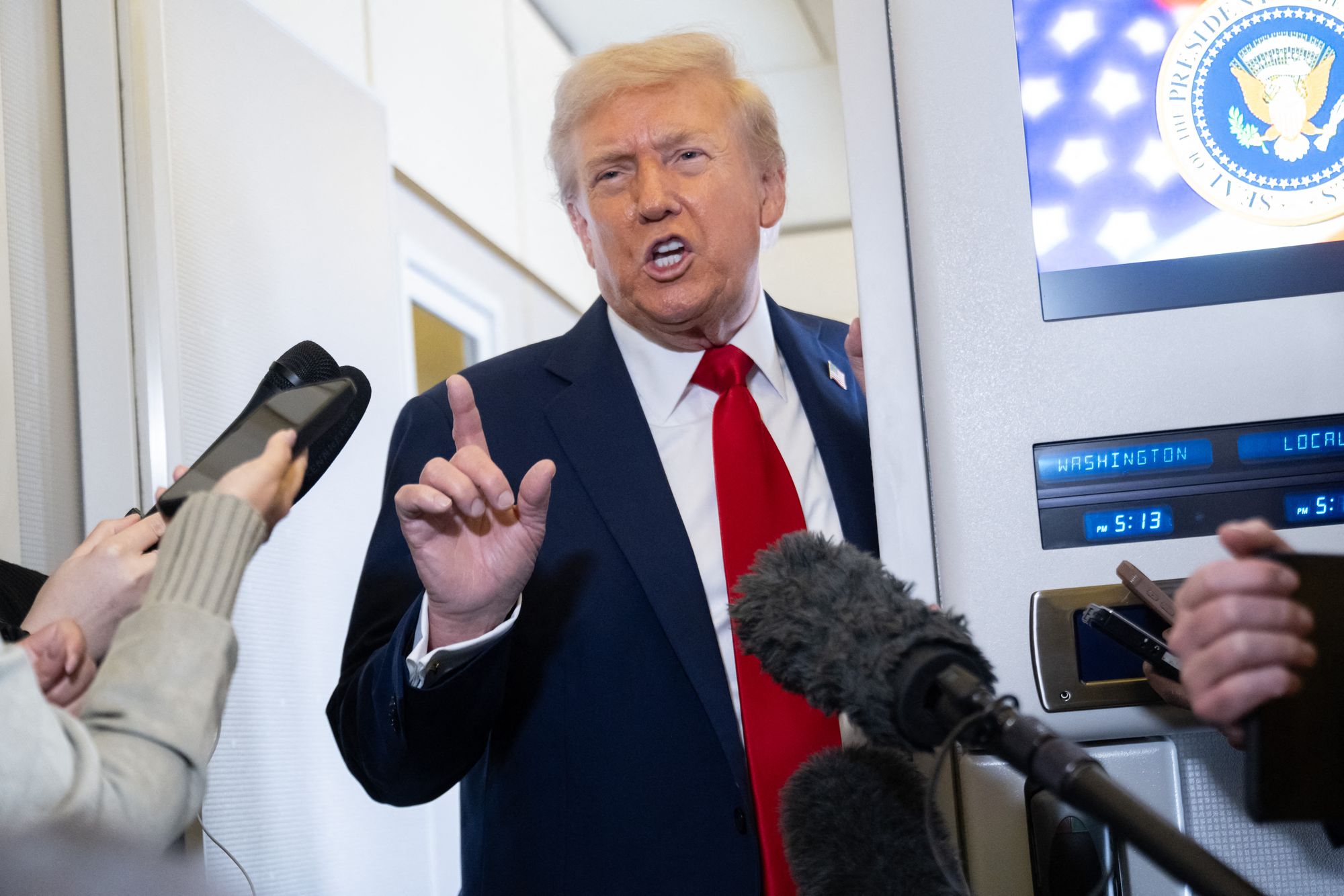 Trump talking to reporters aboard Air Force One en route to Israel