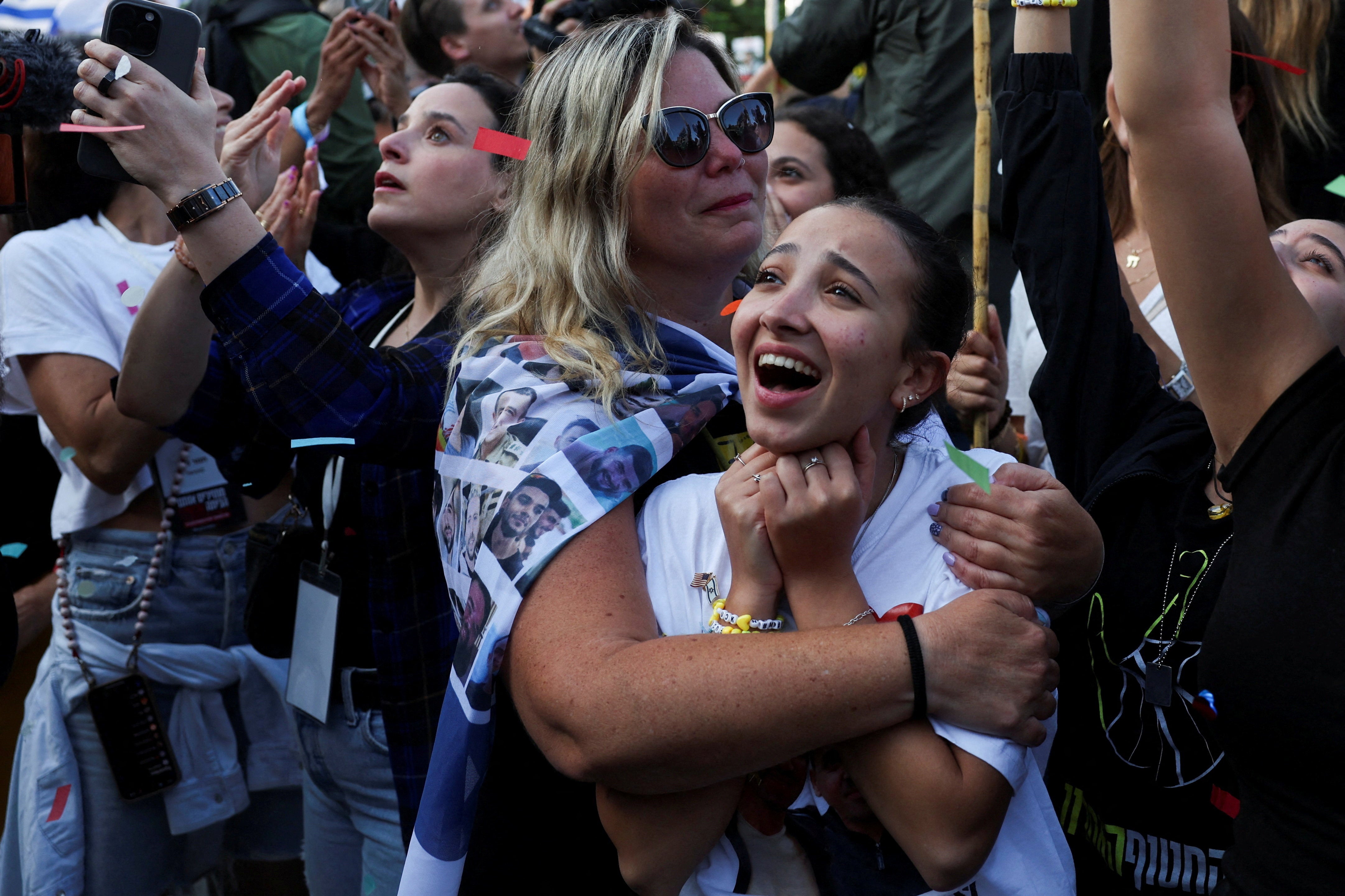 People react in Hostages Square, Israel as news emerged of the release of the first hostages