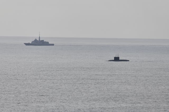 <p>A French navy frigate conducts surveillance of Nato’s maritime approaches, marking the presence of a Russian submarine</p>