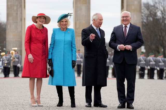 <p>German President Frank-Walter Steinmeier, right, and his wife Elke Buedenbender, left, welcome Britain's King Charles III and Queen Camilla, in front of the Brandenburg Gate in Berlin,</p>