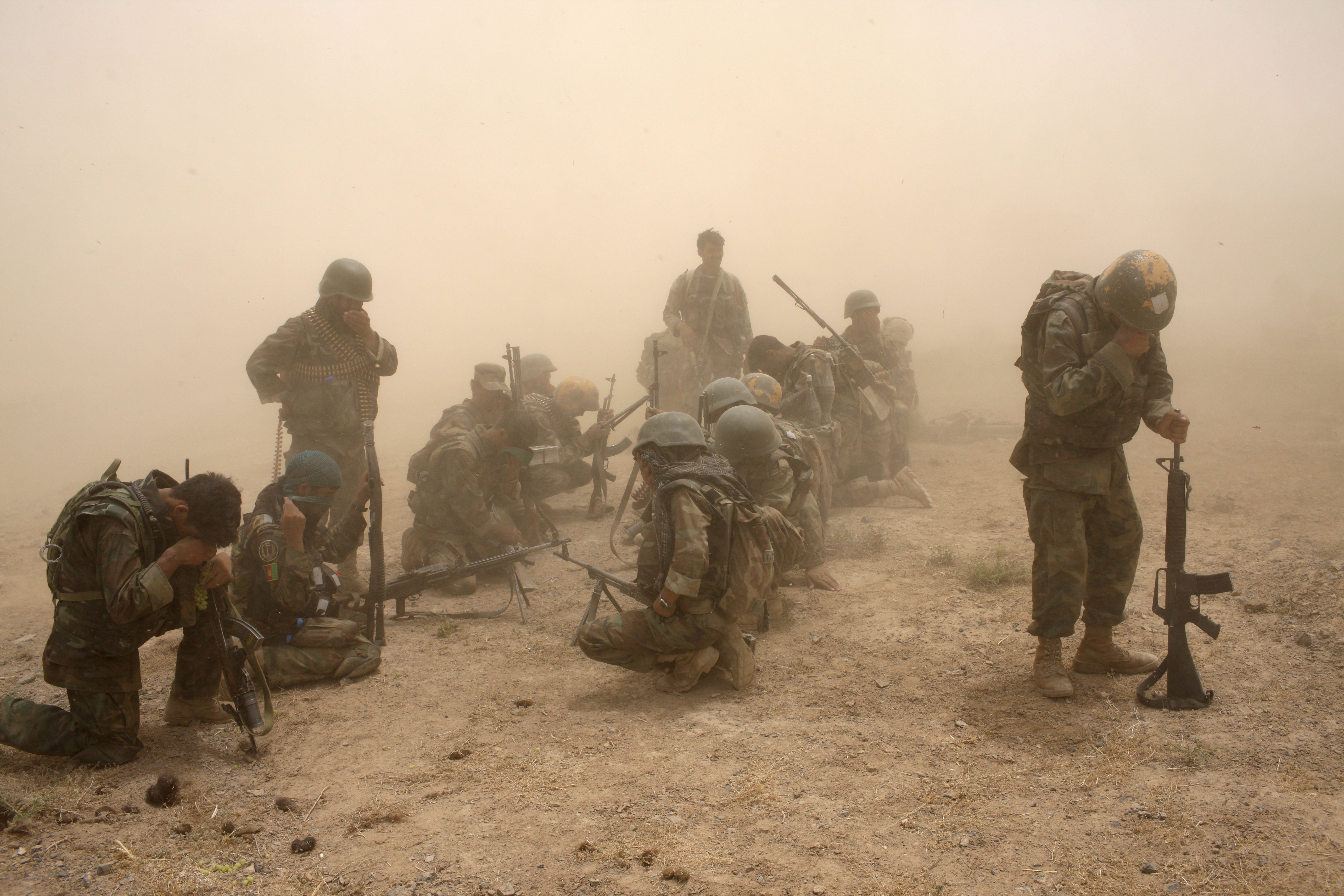 Members of the Afghan Security Forces wait to be extracted by helicopter after an operation to search three compounds and look for weapons on July 1, 2008 in Salavat, Panjawi Province, Afghanistan