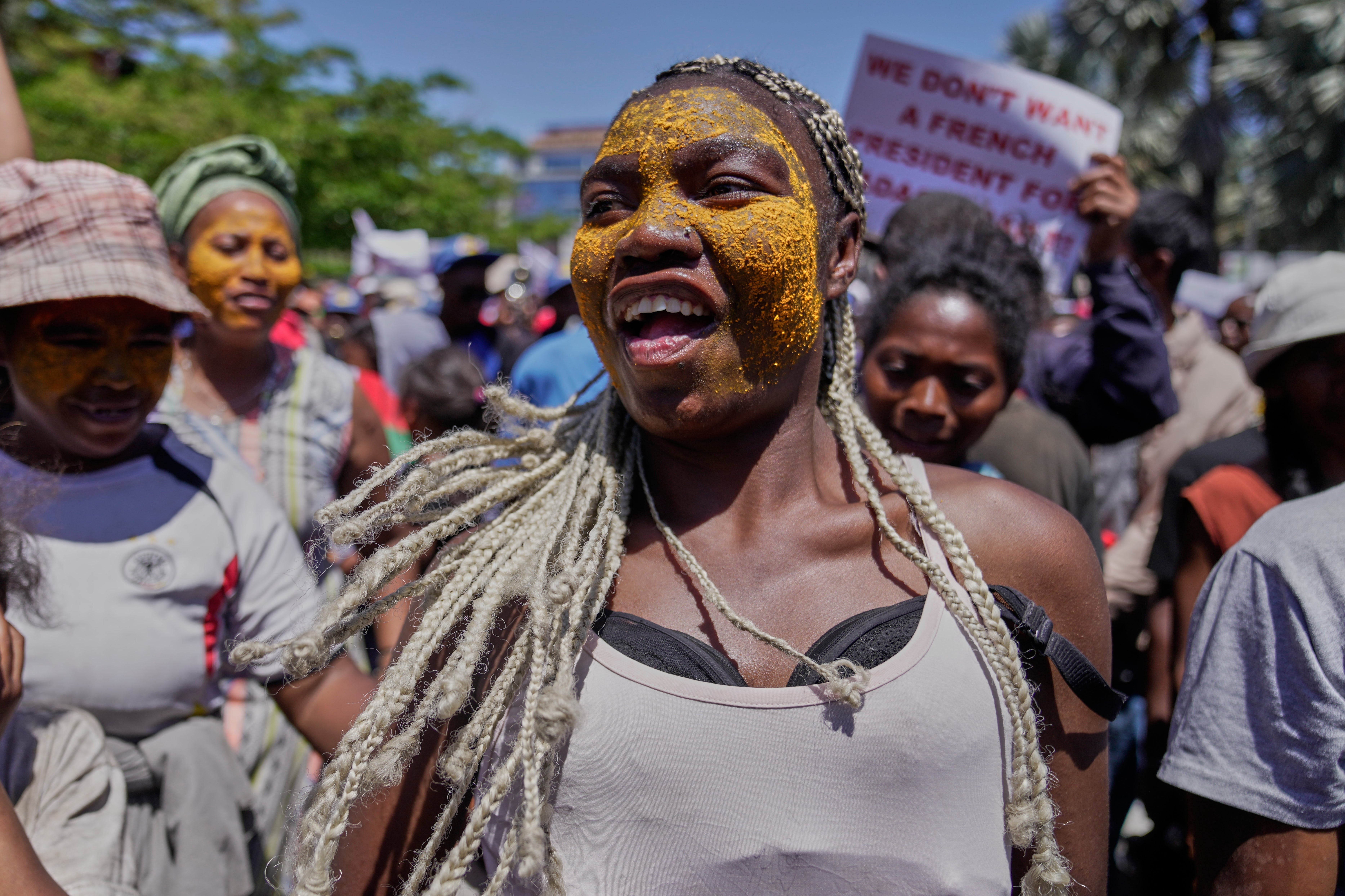 A woman dances during a protest calling for President Andry Rajoelina to step down in Antananarivo, Madagascar