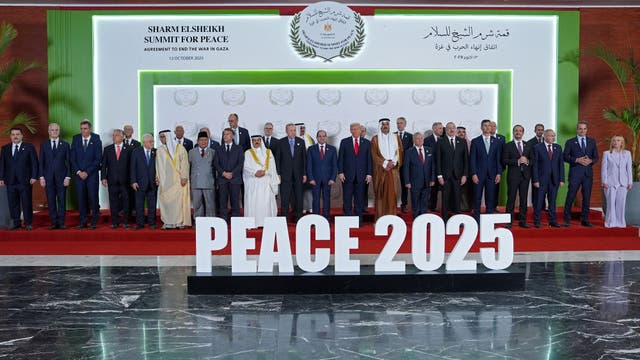 <p>Donald Trump and other world leaders pose for a group photograph at the Sharm el-Sheikh Peace Summit in Egypt on Monday</p>