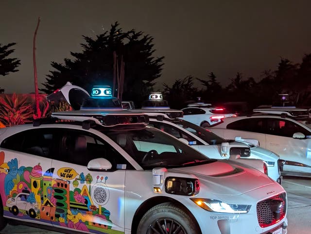 <p>Some of the 50 Waymo driverless cars that clogged a street in the tech-forward California city </p>