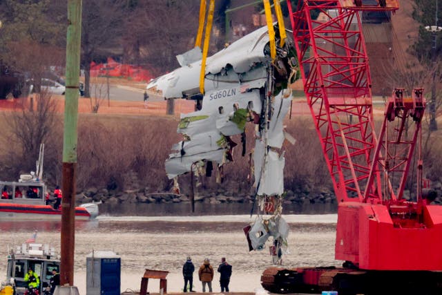 <p>Part of an American Airlines jet is lifted from the Potomac River after it collided with a U.S. Army Black Hawk helicopter </p>