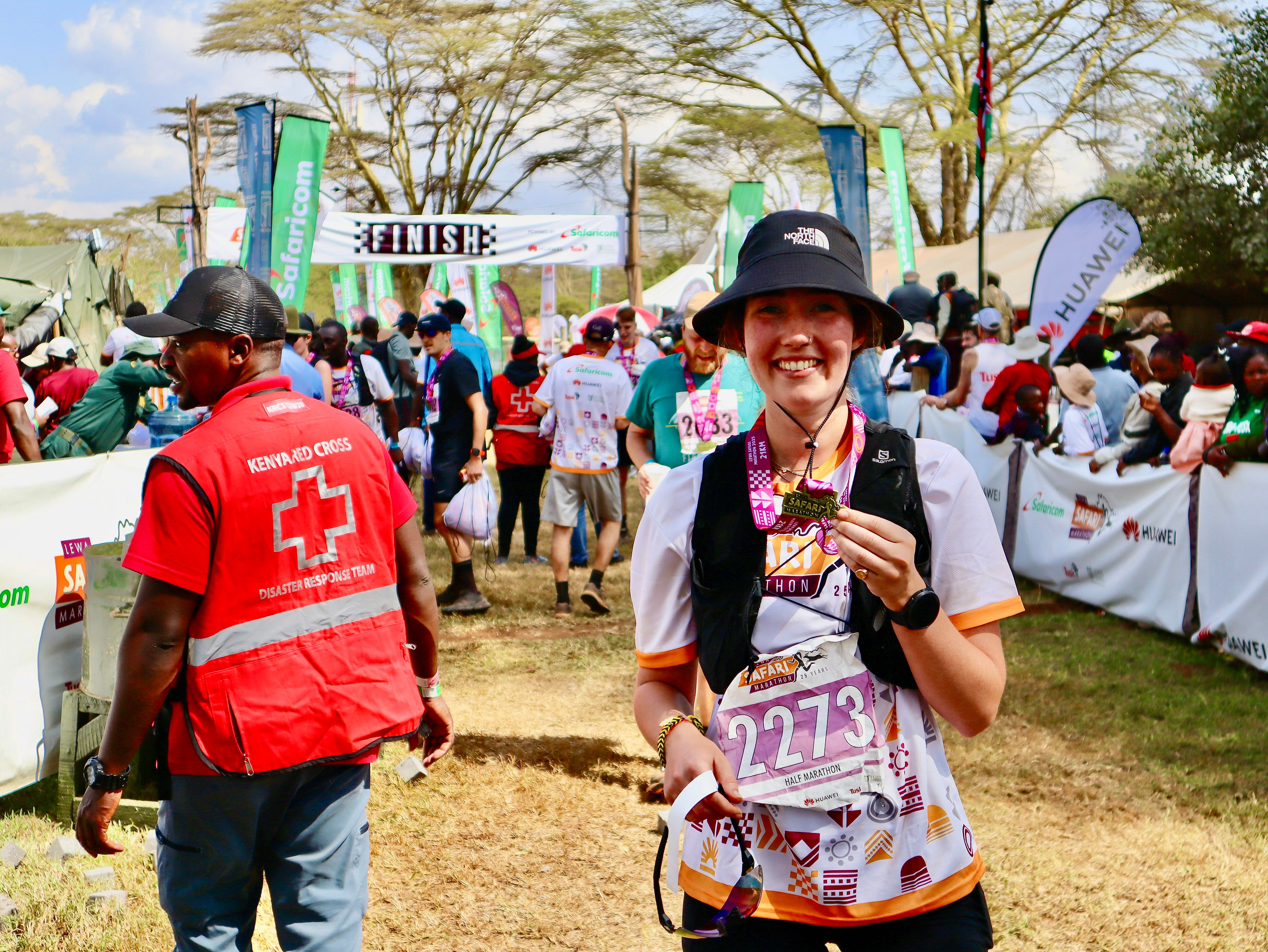 Isabella with medal at the finish line