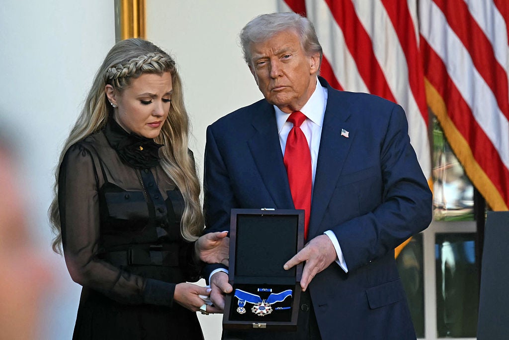 Donald Trump posed for a photo with Erika Kirk at Tuesday's Medal of Freedom ceremony for her late husband Charlie Kirk