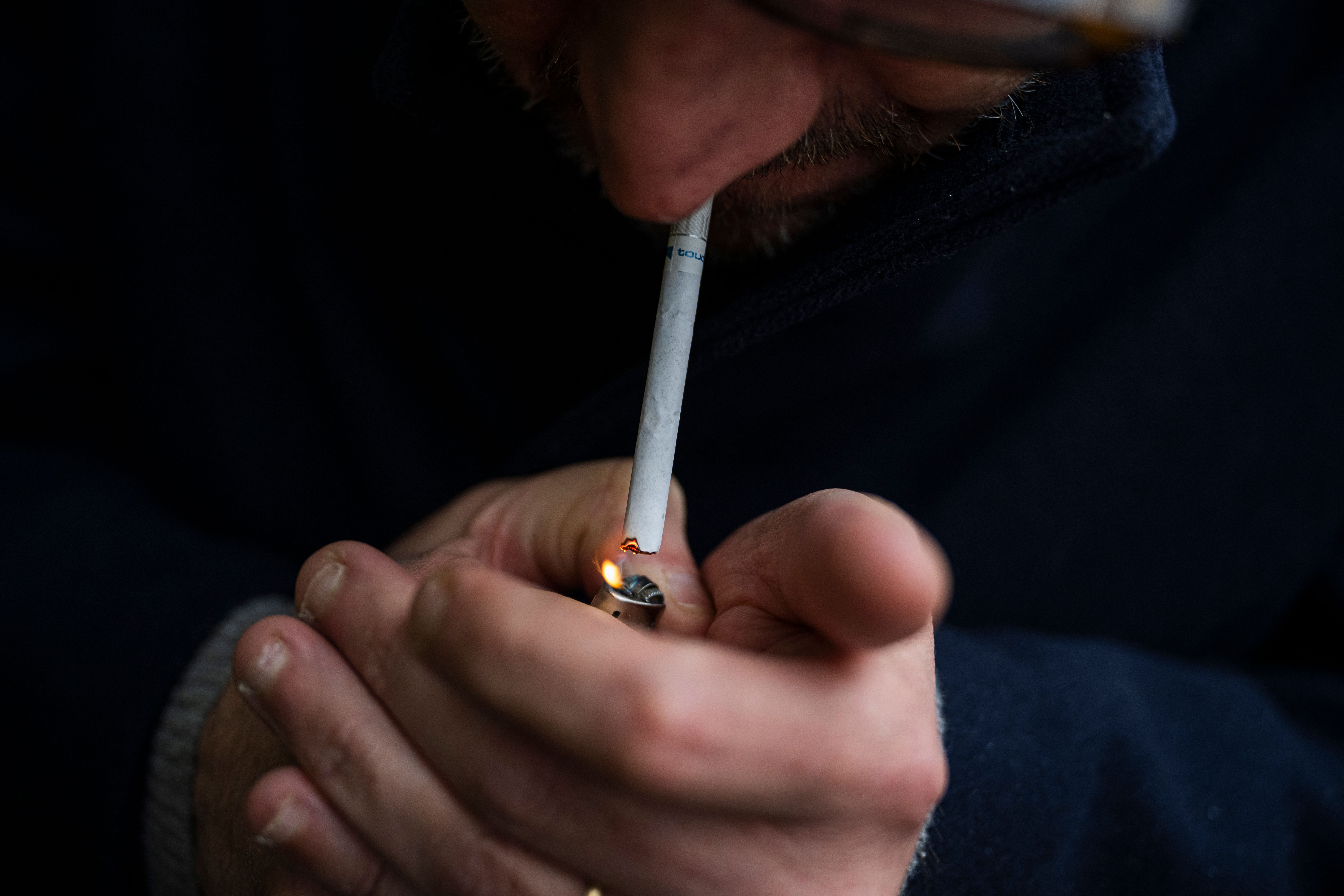 File. Man smokes a cigarette near Stockholm