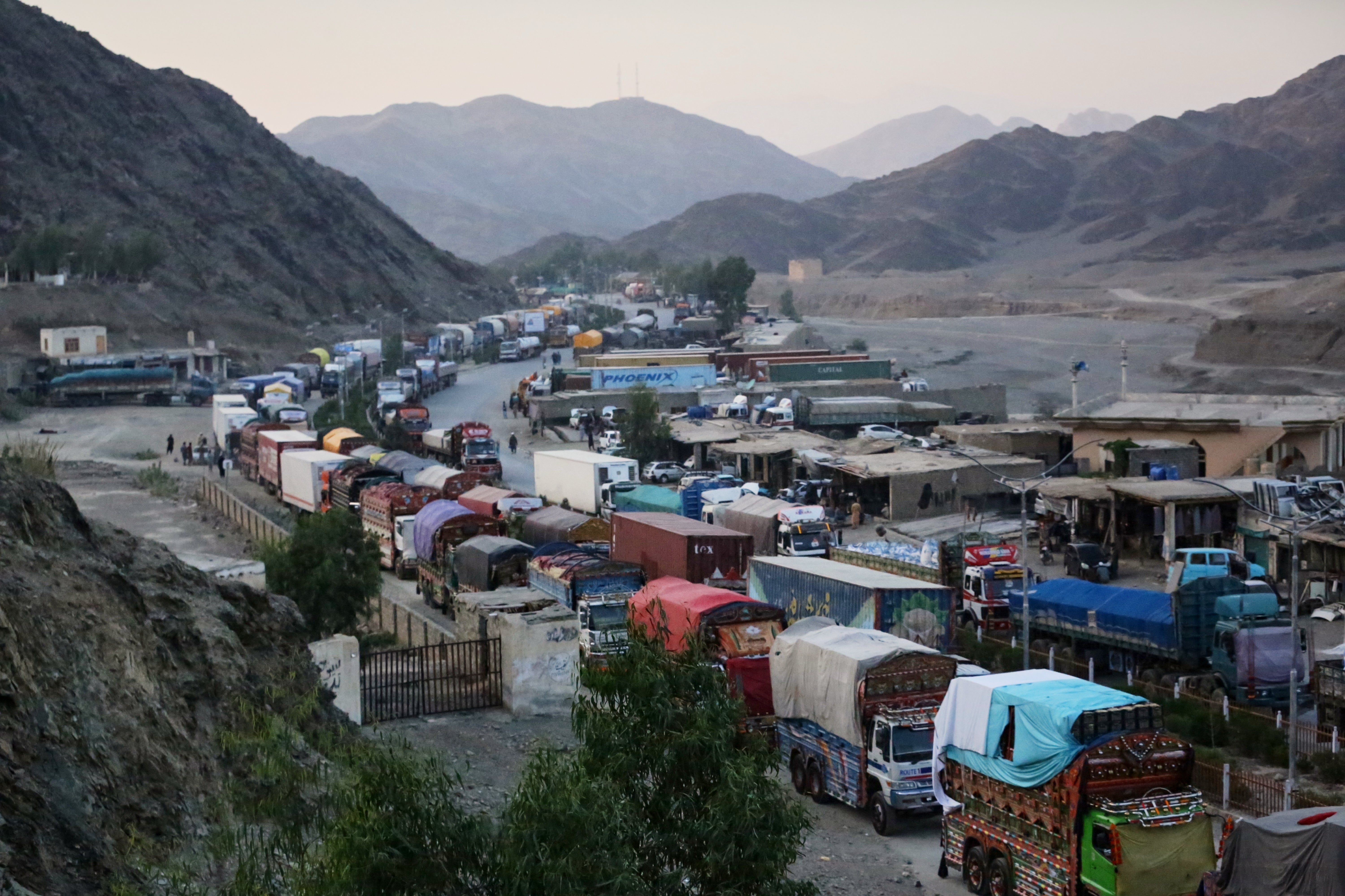 A line of cargo trucks bound for Pakistan is stranded on the Afghan side of the Torkham border crossing, which remained closed after clashes, in Nangarhar province, Afghanistan