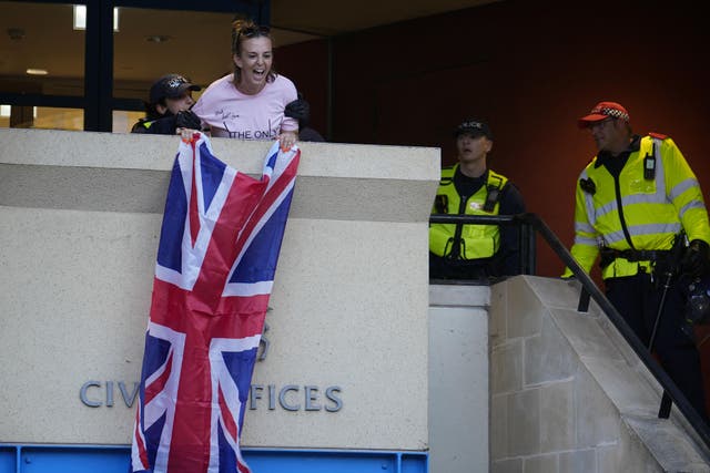 Charges against Sarah White, who unfurled a Union flag from a council building, have been dropped (Jordan Pettitt/PA)